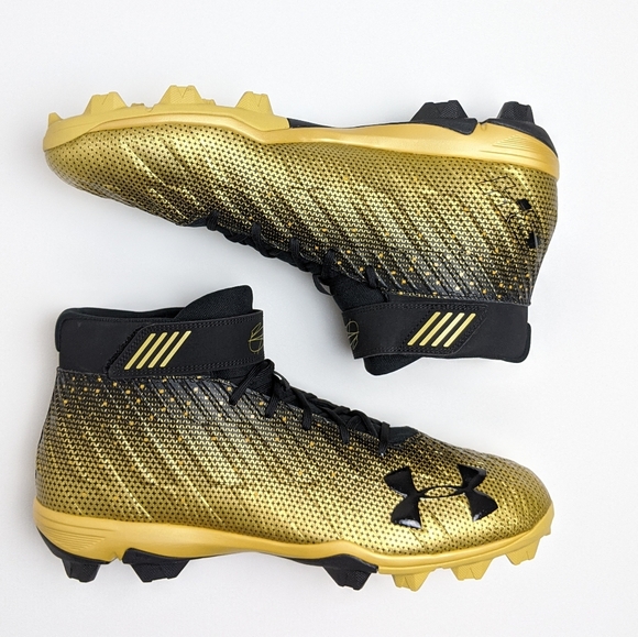 gold and black under armour cleats